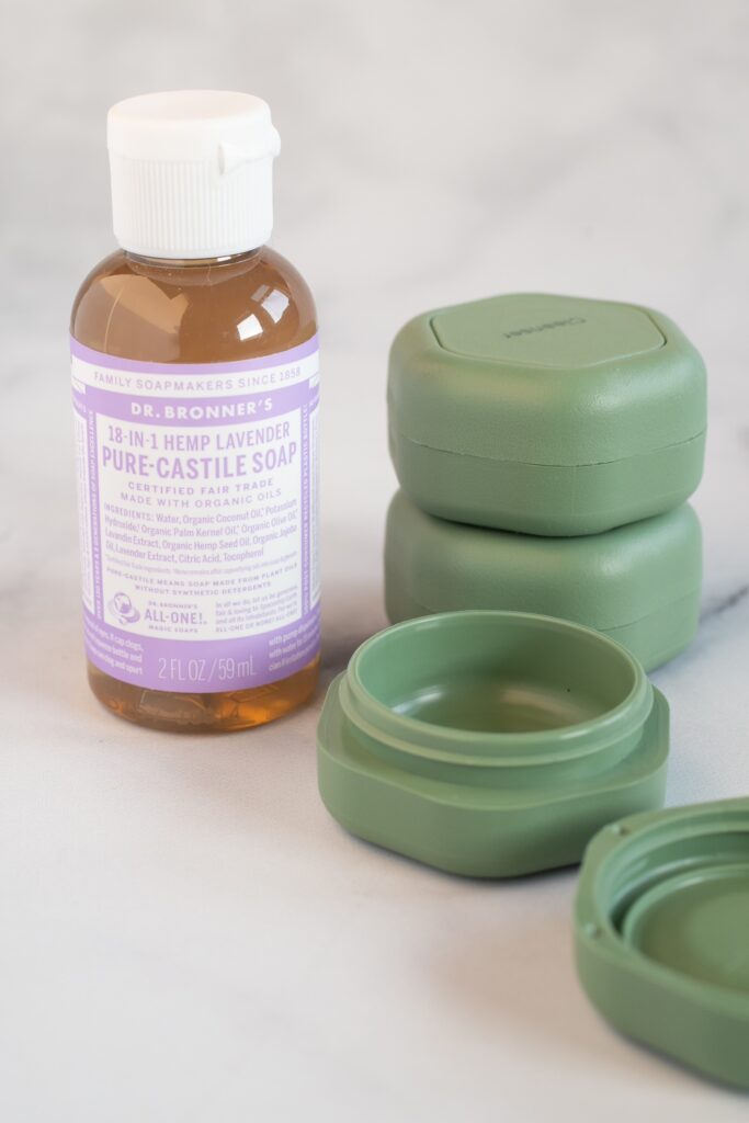 small container of Castile soap and stackable travel containers