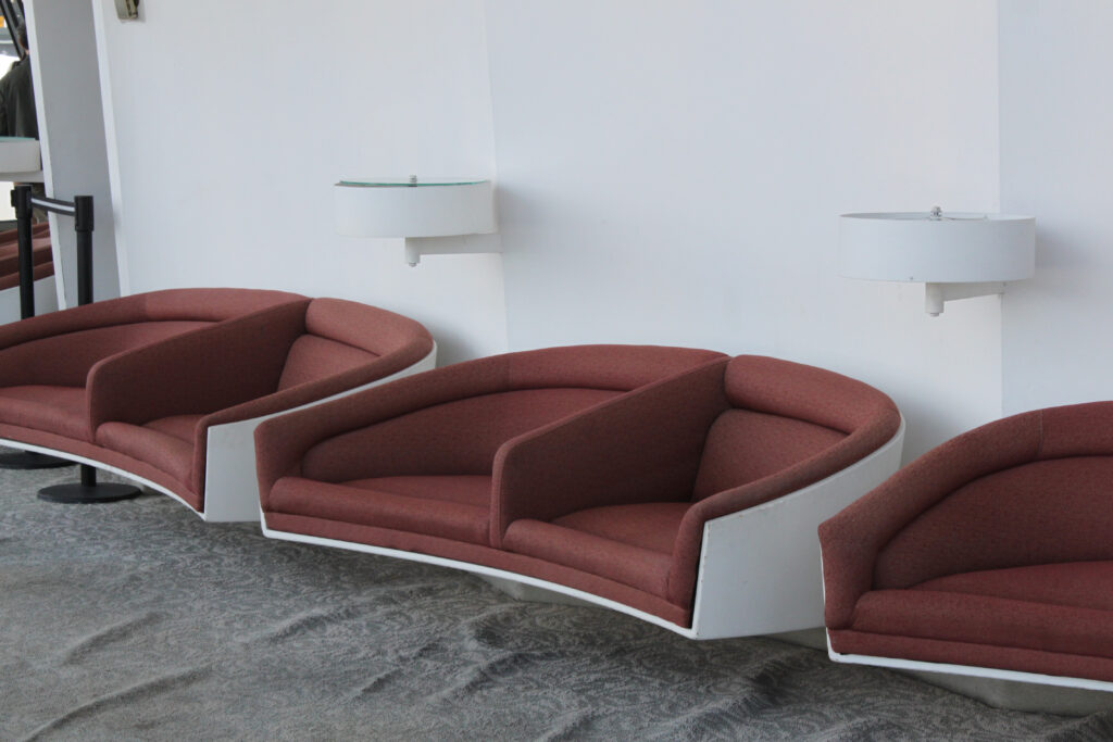faded upholstered midcentury seats in the TWA terminal, 2011