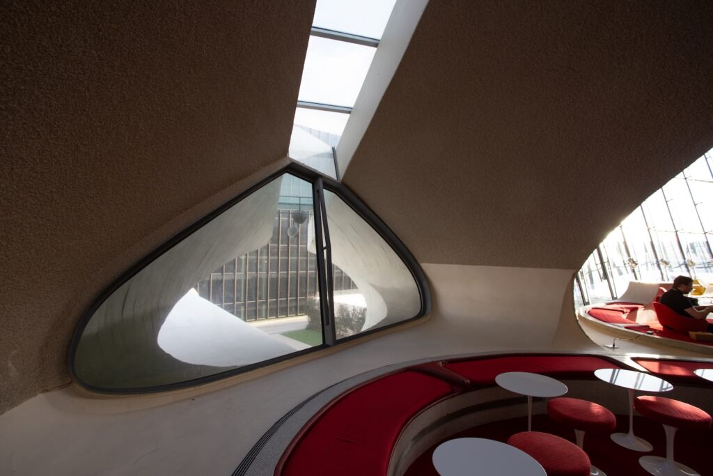 windows and banquettes at the TWA Hotel bar