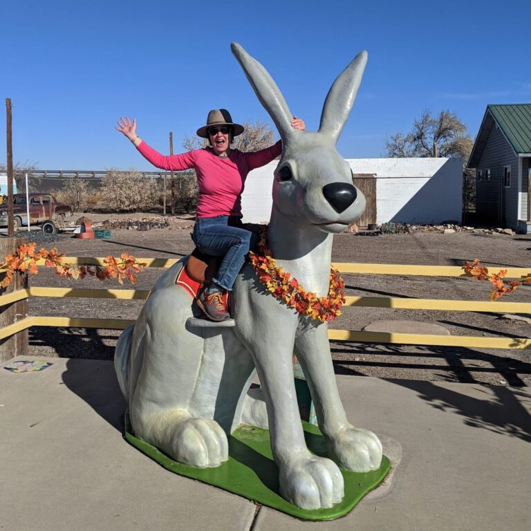 girl on a large jackrabbit statue