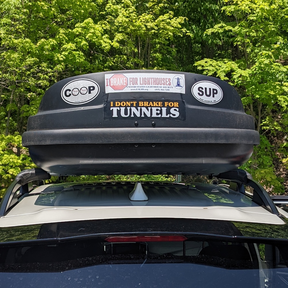 rooftop box on a car with stickers