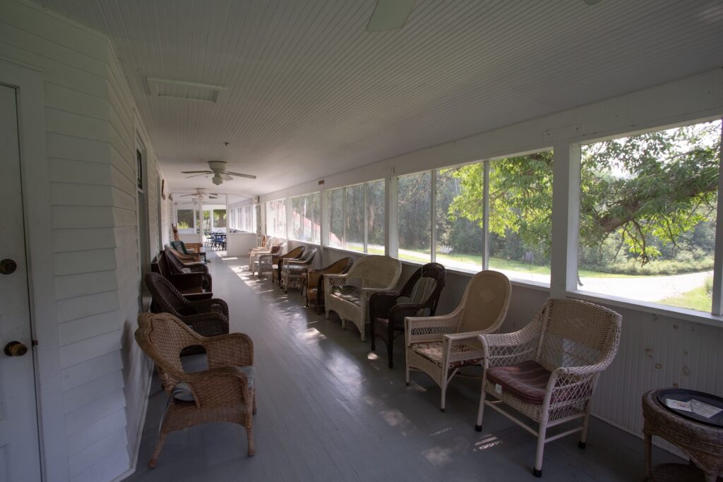 Kettle Falls Hotel porch with wicker chairs in Voyageurs National Park