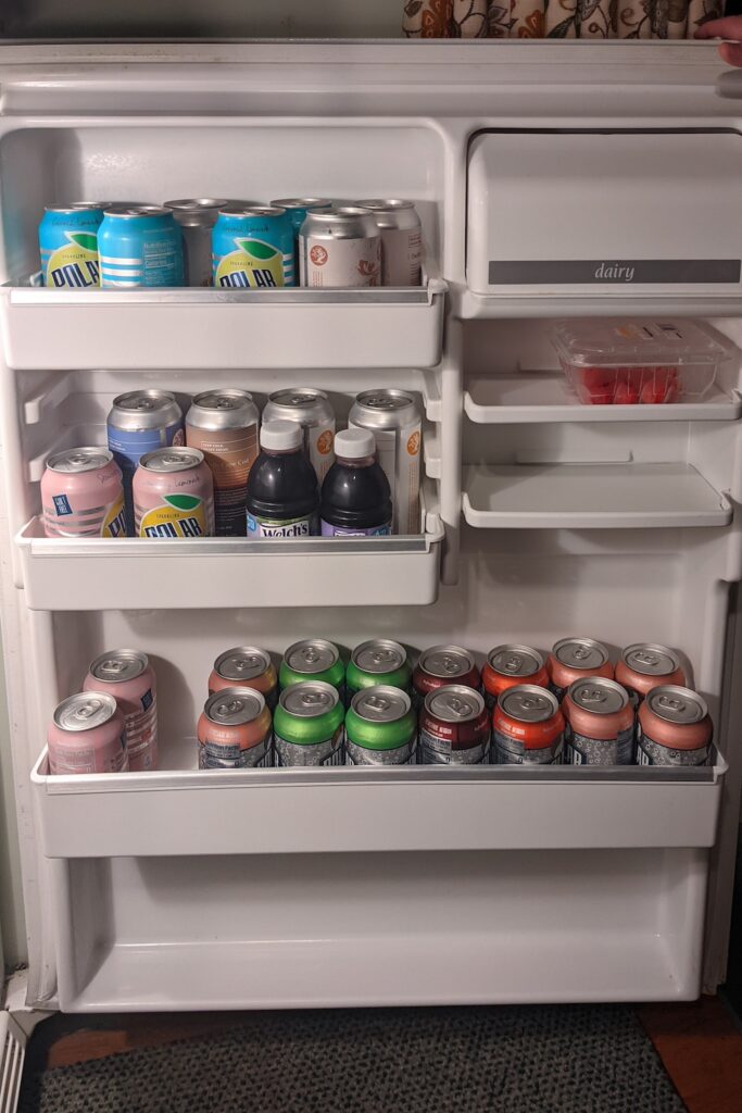 cans of polar seltzer in a refrigerator