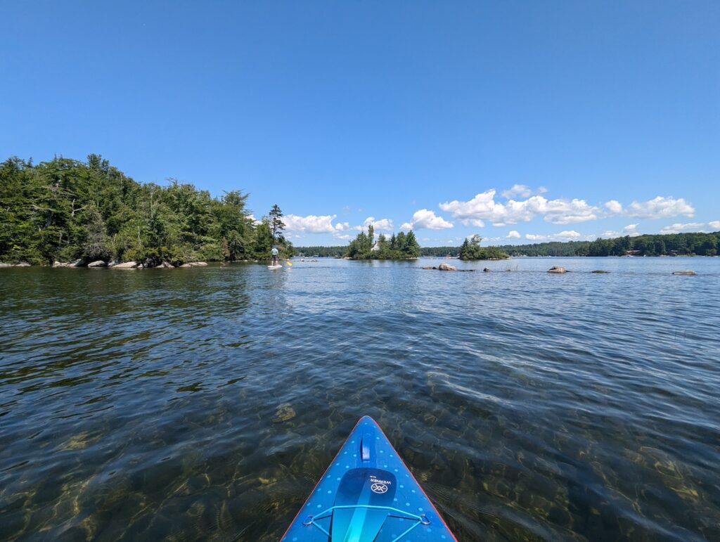 view of Lake Winnipesaukee from a paddleboard