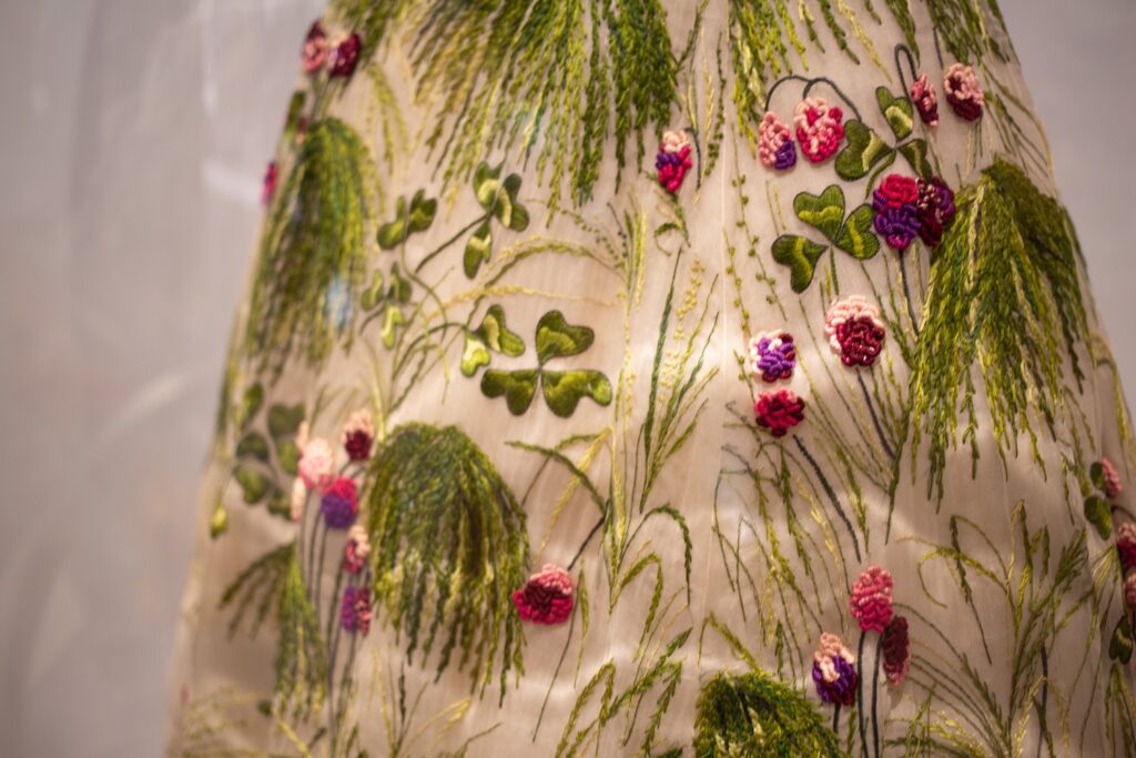 detail of a Dior embroidered clover dress in the Met Sleeping Beauties exhibition