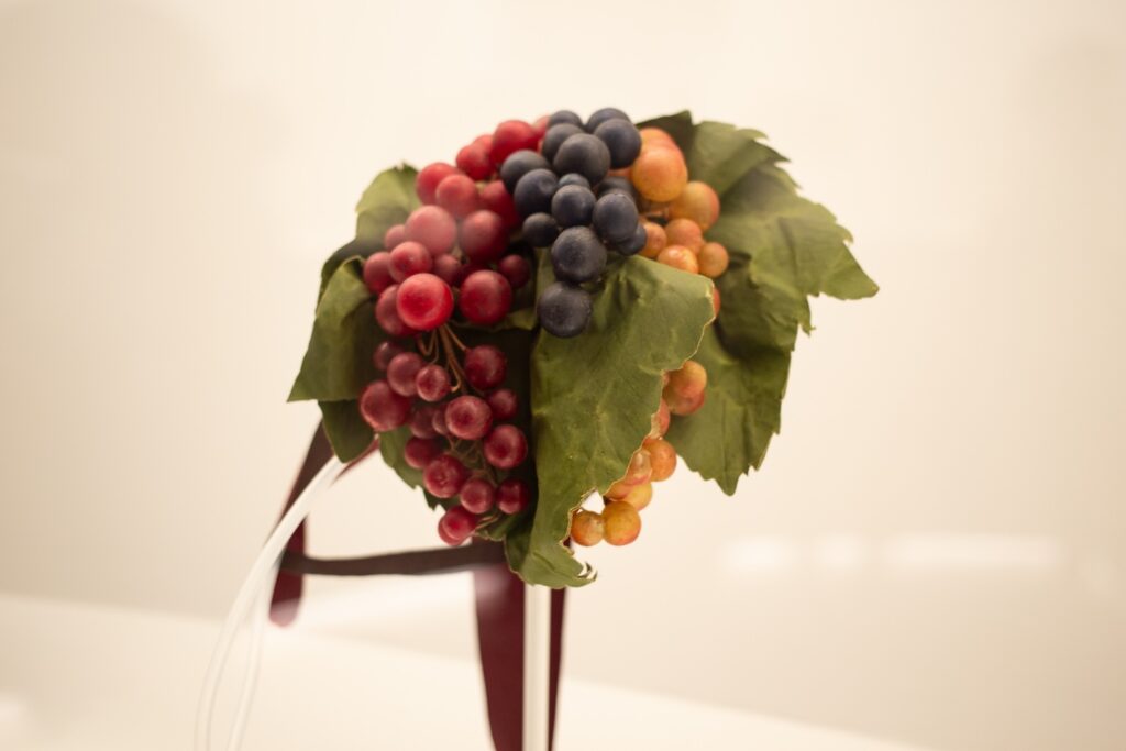 hat made of fake grapes