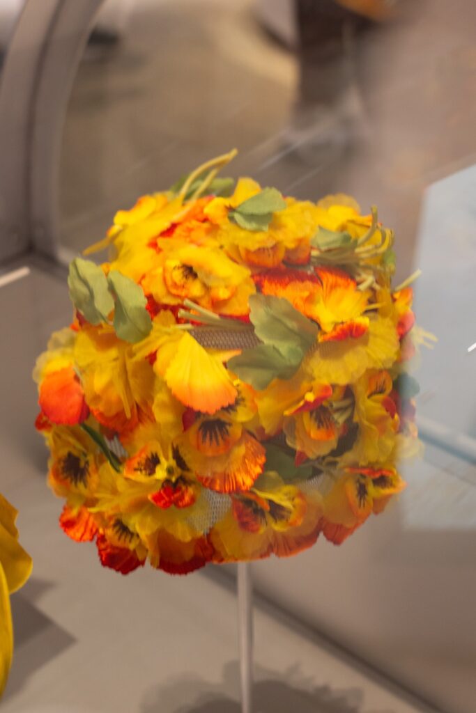 hat covered in faux petunias