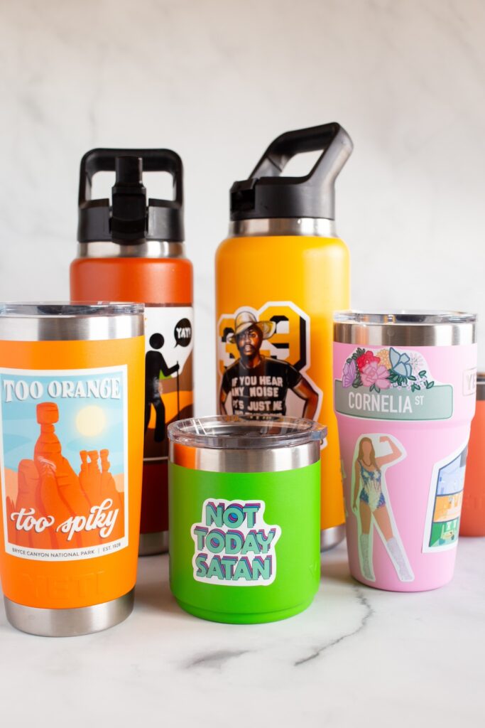collection of Yeti tumblers with stickers