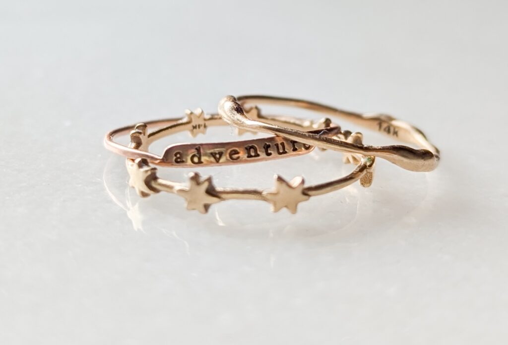stack of gold rings with stars